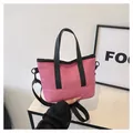 Pink nylon mini tote bag with adjustable black shoulder strap and zipper closure - Rose Red