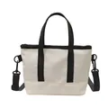 Mini canvas tote bag in off-white with black straps and adjustable shoulder strap - White