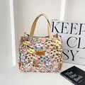 Pink canvas tote bag with cute cat prints, brown leather label and woven handles - Pink