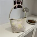 Floral embroidered canvas bucket bag in cream white with vintage yellow flower patterns - Off White