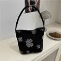 Chinese style bucket bag featuring white floral embroidery on premium black fabric - Black