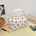 White corduroy cosmetic bag with red strawberry pattern and convenient top handle - Strawberry Print White