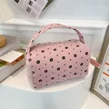 Pink corduroy makeup bag with cute black floral pattern and portable top handle - Flower Style Pink