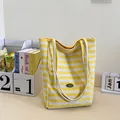 Yellow and white striped canvas tote bag with cream rope handles and handmade label - Yellow