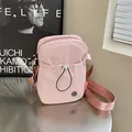 Sac à bandoulière en nylon rose avec cordon de serrage et large sangle réglable - Rose