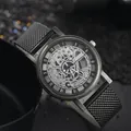 Fashionable skeleton quartz watch with black mesh strap and Roman numerals on dark sand - Black
