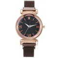 Dettaglio quadrante stellato oro rosa con numeri romani e cinturino a maglia da donna - Orologio Caffè