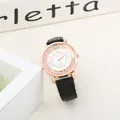 Detailed macro view of a rose gold quartz watch with Roman numerals and sparkling crystals - Black