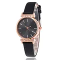 Women's quartz watch with black leather strap and rose gold rhinestone accents - Black