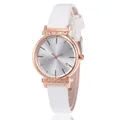 Detail showing rose gold watch case with rhinestone lugs and a white leather strap - White