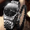 Close-up of silver steel watch and black matte beaded bracelet on a dark wood background - Silver Black Dial