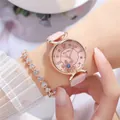 Detail of pink leather watch with rotating snowflake dial and heart-shaped bracelet set - Watch And Bracelet / Pink