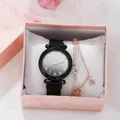 Close-up of women's quartz watch and rose gold star bracelet in a pink gift box - Watch Bracelet Gift Box Set / Black
