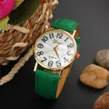Fashion quartz watch featuring a green leather strap and gold case with shell dial - Green