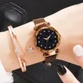 Macro shot of rose gold Milanese strap watch with starry dial and star charm bracelet - Watch And Bracelet / Coffee
