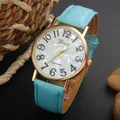 Geneva women's watch with light blue leather strap and textured gold metal dial - Light Blue
