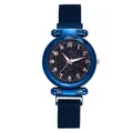 Detailed view of the starry blue dial with rose gold numerals and Milanese mesh strap - Blue