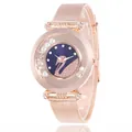 Detailed view of rose gold mesh band watch featuring a sparkling swan crystal dial - Blue