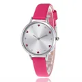 Macro detail of silver watch dial with red heart hour markers and rose pink leather strap - Rose Red