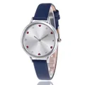 Detail view of women's watch with heart-shaped rhinestone markers and blue leather strap - Blue