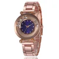 Detail view of rose gold alloy watch with blue dial and floating rhinestones on bezel - Blue
