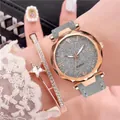 Detail of rose gold quartz watch with star bracelet set on woman wrist - Grey + Bracelet