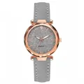 Macro detail of women quartz watch with rose gold case and faceted glass crystal - Gray