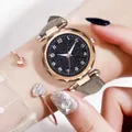 Close-up of starry sky dial watch with rose gold faceted bezel and gray matte leather strap - Watch And Bracelet / Gray
