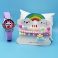 Close-up of a kids cartoon panda watch with purple silicone strap and beaded bracelets - Purple Panda