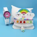 Close-up of girls cartoon quartz watch and matching beaded bracelets on display pillow - White Alpaca