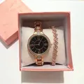 Dettaglio set orologio oro rosa con numeri romani e bracciale cuore in regalo - Oro Rosa + Braccialetto + Scatola