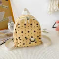 Mini yellow corduroy backpack with black floral patterns and cream webbing straps - Flower Style / Yellow