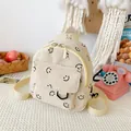 Mini zaino in velluto a coste beige con motivi smiley neri e tasca frontale a zip - Bianco