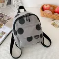 Mini corduroy backpack in light grey with black polka dots for casual student lifestyle - Gray