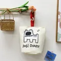 White canvas bucket bag featuring a cute cartoon dog print with red hanging cord - White/Red Dog (Magnetic)