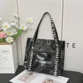 Glossy black patent leather tote bag with white Fashion print and webbed handles - Black