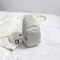 White corduroy crossbody chest bag with adjustable strap and textured finish - White