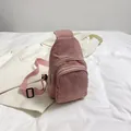 Pink corduroy crossbody waist bag featuring dual zippers and adjustable strap - Pink