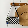 Checkered black and white canvas shoulder bag with decorative strap detail - With Pendant / Black
