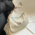 Minimalist beige underarm bag with artistic colorful ink patterns and metal letter charms - Iridescent Letter Print / Off White