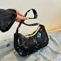 Black canvas hobo bag with colorful graffiti letters and artistic paint splash prints - Blue and White Ink Splatter / Black