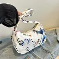 White canvas hobo bag with blue graffiti and Never Hope print for casual shoulder wear - Blue