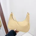 Minimalist light yellow nylon crescent underarm bag with zipper and slim shoulder strap - Yellow