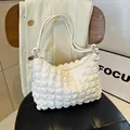 Chic pleated croissant bag in creamy white with textured fabric and dual handles - White