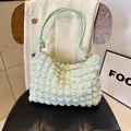 Mint green pleated shoulder bag with unique bubble texture and slim handles - Green