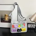Grey canvas dumpling bag with ENJOY text and three colorful cartoon plush cat faces - Gray