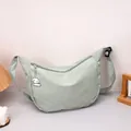 Light green waffle fabric half-moon crossbody bag with cute white puppy pendant - Green