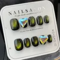 Handmade green cat eye press-on nails with heart rhinestones and black base finish - High-end Light-chasing Cat Eye / Large (L)