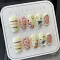 Handmade press-on nails with cream pink graffiti heart patterns and sparkling rhinestones - L / Graffiti Spicy Girl
