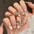 Faux ongles œil de chat champagne avec motif léopard et strass sur forme ovale longue - XS / Ovale Long